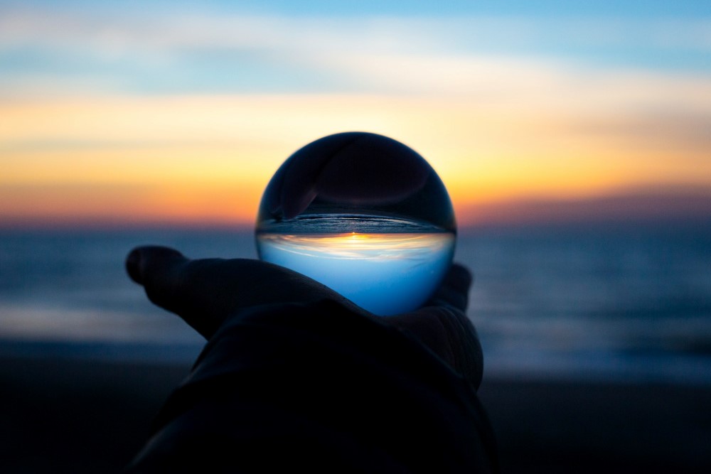 A glass ball on the sunset background